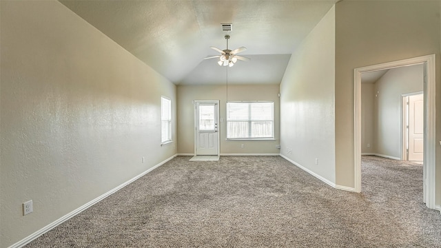 32706 Oak Heights Ln, Brookshire, TX 77423 - spare room featuring a ceiling fan, carpet, vaulted ceiling, and baseboards