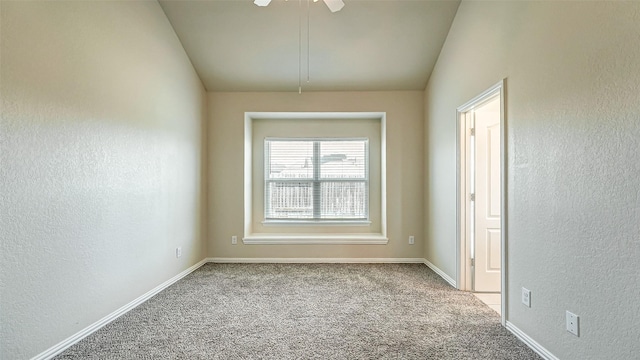 32706 Oak Heights Ln, Brookshire, TX 77423 - spare room featuring carpet floors, a textured wall, lofted ceiling, ceiling fan, and baseboards