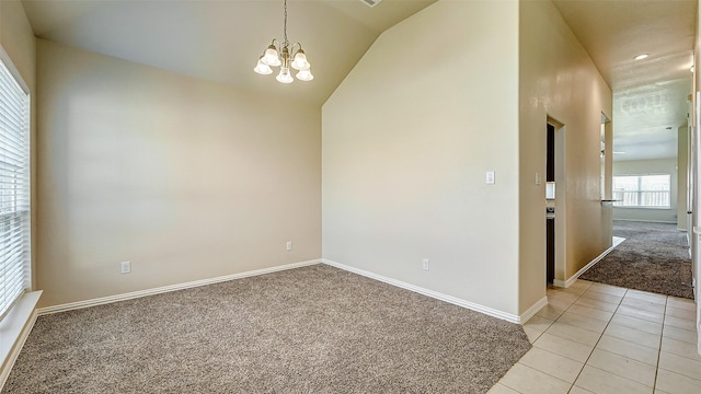 32706 Oak Heights Ln, Brookshire, TX 77423 - spare room featuring light colored carpet, a chandelier, baseboards, lofted ceiling, and light tile patterned flooring