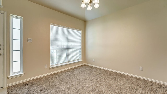 32706 Oak Heights Ln, Brookshire, TX 77423 - unfurnished room with a chandelier, light colored carpet, and baseboards