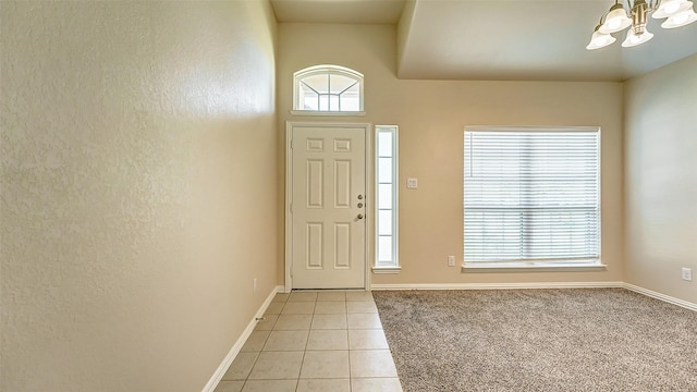 32706 Oak Heights Ln, Brookshire, TX 77423 - entrance foyer featuring a chandelier, light tile patterned floors, and baseboards