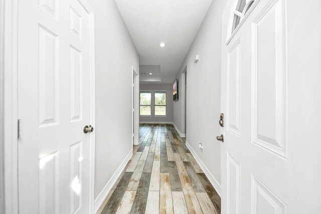 25450 Killarney St, Hempstead, TX 77445 - hallway with hardwood / wood-style flooring, baseboards, and recessed lighting
