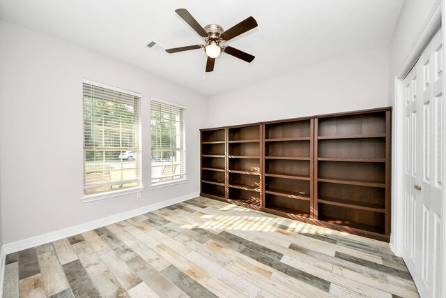 25450 Killarney St, Hempstead, TX 77445 - empty room with wood finished floors, ceiling fan, and baseboards