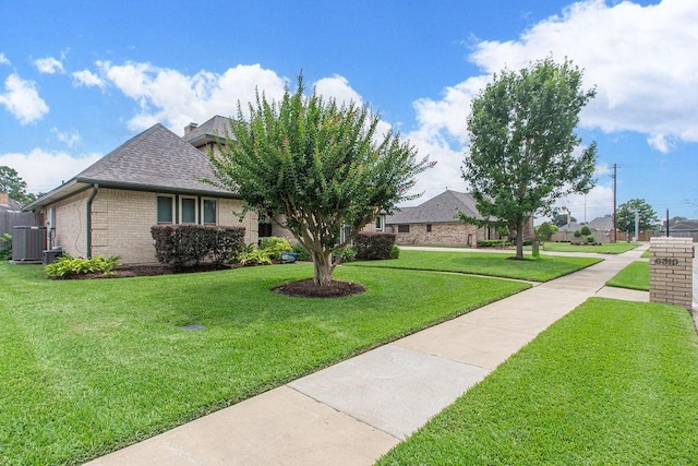 6310 Gleneagles Dr, Pasadena, TX 77505 - view of front of property with brick siding, a front lawn, and roof with shingles