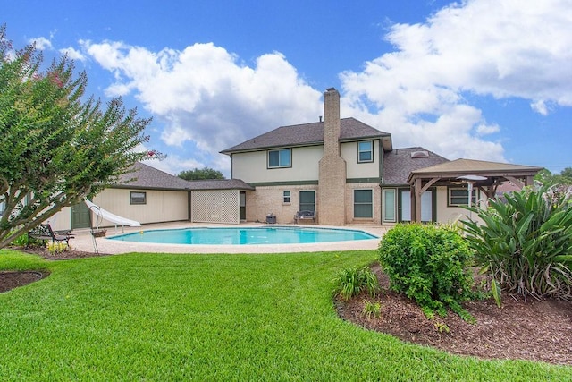 6310 Gleneagles Dr, Pasadena, TX 77505 - outdoor pool with a water slide and a lawn