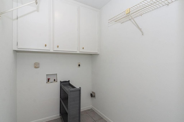 6310 Gleneagles Dr, Pasadena, TX 77505 - laundry room with hookup for an electric dryer, cabinet space, hookup for a washing machine, and tile patterned flooring