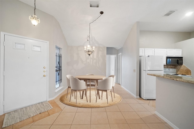 3317 Golden Trails Dr Unit 802, Houston, TX 77345 - dining area featuring lofted ceiling, a chandelier, light tile patterned flooring, and baseboards