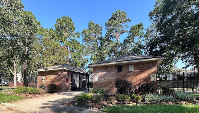 3317 Golden Trails Dr Unit 802, Houston, TX 77345 - view of front facade with a gate and brick siding