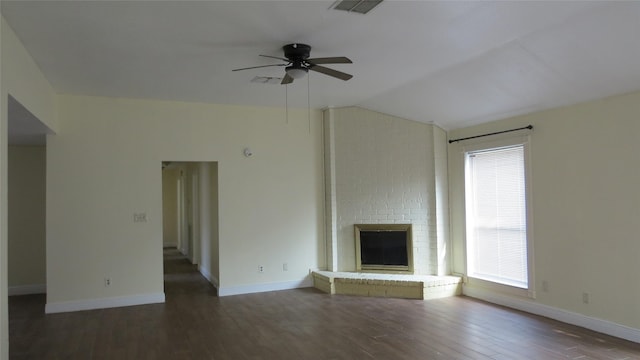 2223 Sentinal Oaks St, Sugar Land, TX 77478 - unfurnished living room with ceiling fan, vaulted ceiling, wood finished floors, baseboards, and a brick fireplace