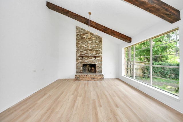 3223 Deer Valley Dr, Spring, TX 77373 - unfurnished living room featuring wood finished floors, a brick fireplace, plenty of natural light, and baseboards