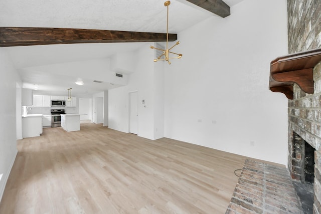3223 Deer Valley Dr, Spring, TX 77373 - unfurnished living room with light wood-style floors, a fireplace, a sink, and a chandelier