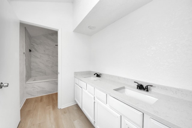 3223 Deer Valley Dr, Spring, TX 77373 - full bathroom featuring a shower, double vanity, and wood finished floors