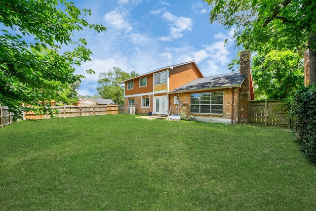 3223 Deer Valley Dr, Spring, TX 77373 - rear view of house with a chimney, brick siding, and french doors