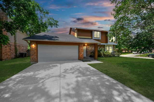 3223 Deer Valley Dr, Spring, TX 77373 - view of front of house featuring brick siding, a garage, central AC unit, driveway, and a lawn