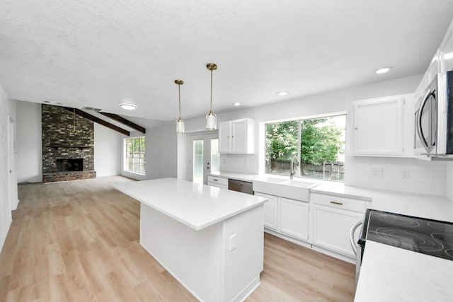 3223 Deer Valley Dr, Spring, TX 77373 - kitchen with appliances with stainless steel finishes, light countertops, white cabinets, and recessed lighting