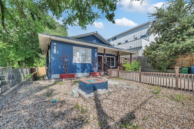1138 Northwestern Ave, Austin, TX 78702 - view of front facade featuring a porch, a fenced backyard, and a ceiling fan