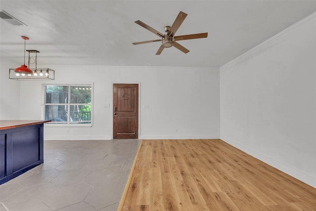 1138 Northwestern Ave, Austin, TX 78702 - unfurnished living room with a ceiling fan and baseboards