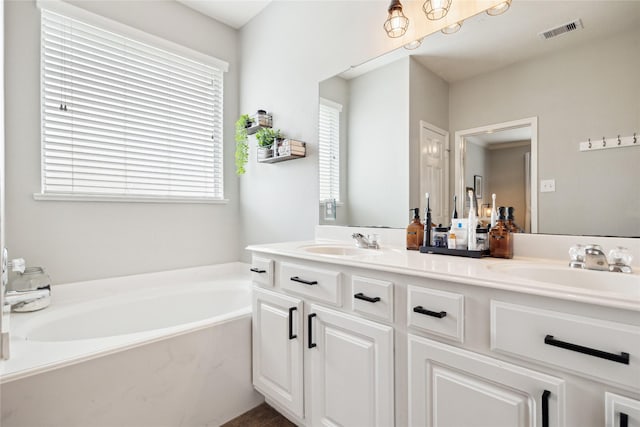 2304 Cantabria Ln, League City, TX 77573 - full bathroom featuring double vanity and a bath