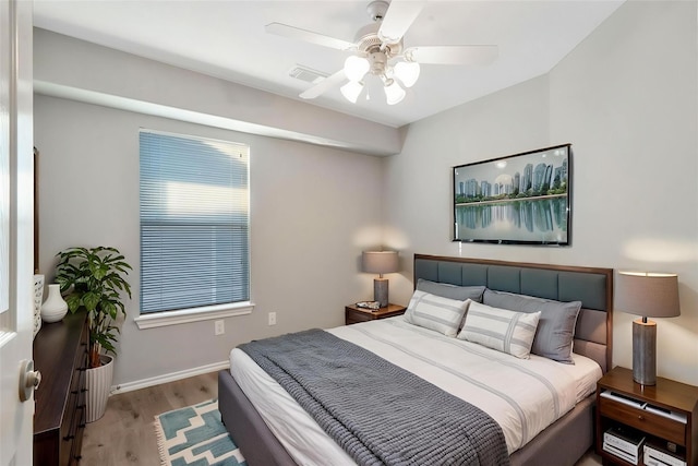 17139 Oakwood Chase Dr, Spring, TX 77379 - bedroom featuring wood finished floors, baseboards, and a ceiling fan