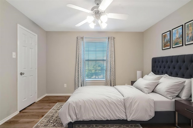 17139 Oakwood Chase Dr, Spring, TX 77379 - bedroom featuring wood finished floors, baseboards, and a ceiling fan