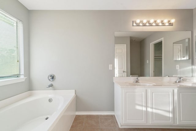 17139 Oakwood Chase Dr, Spring, TX 77379 - bathroom with a bath, double vanity, tile patterned floors, and baseboards