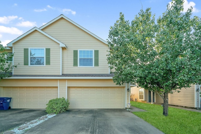 17139 Oakwood Chase Dr, Spring, TX 77379 - view of front of house with driveway, a garage, a shingled roof, and a front yard