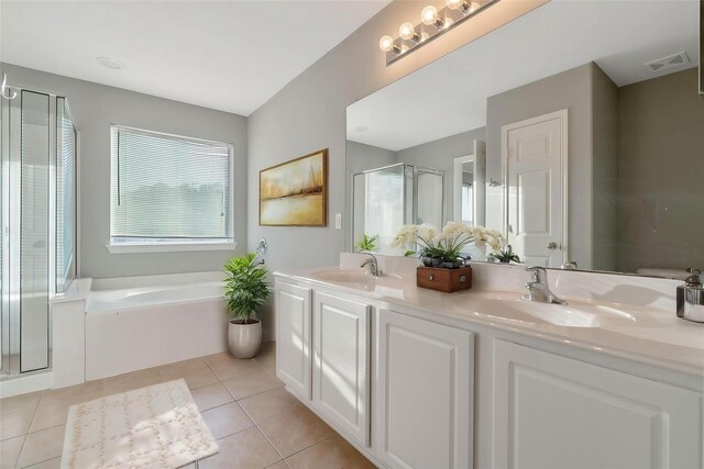 17139 Oakwood Chase Dr, Spring, TX 77379 - bathroom with a shower stall, a bath, tile patterned flooring, and double vanity