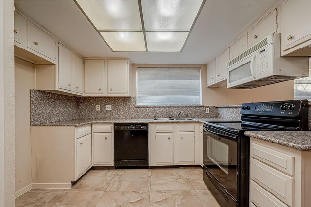 7650 Smiling Wood Ln, Houston, TX 77086 - kitchen with black appliances, a sink, and tasteful backsplash
