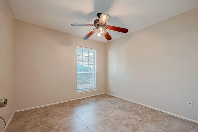 7650 Smiling Wood Ln, Houston, TX 77086 - empty room with a ceiling fan and baseboards