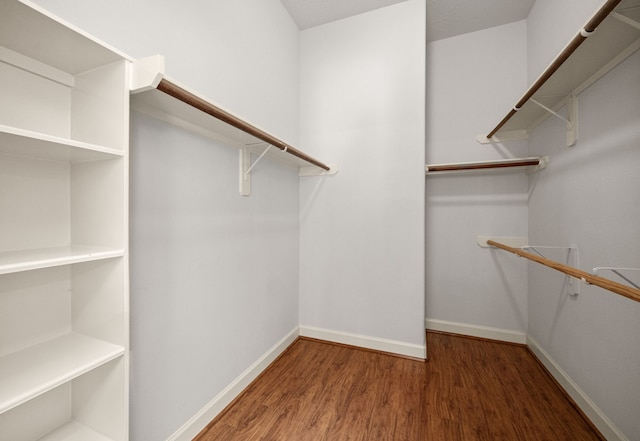 1803 Mustang Xing, Missouri City, TX 77459 - walk in closet featuring wood finished floors