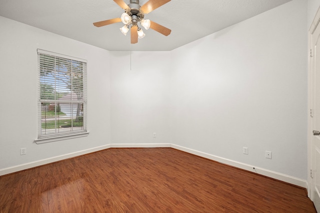 1803 Mustang Xing, Missouri City, TX 77459 - empty room featuring dark wood finished floors, baseboards, and ceiling fan