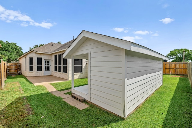 1803 Mustang Xing, Missouri City, TX 77459 - rear view of property with brick siding, a patio, and an outdoor structure