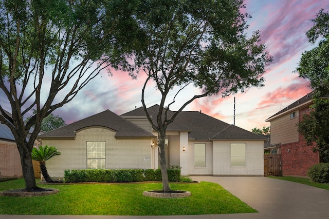 1803 Mustang Xing, Missouri City, TX 77459 - view of front facade featuring brick siding, driveway, and a shingled roof