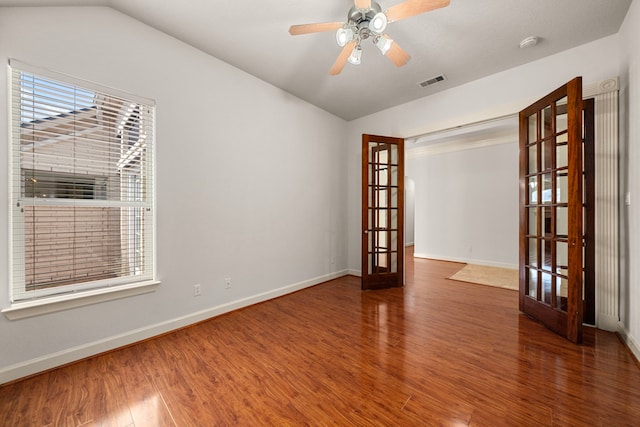 1803 Mustang Xing, Missouri City, TX 77459 - unfurnished room with french doors, lofted ceiling, wood finished floors, baseboards, and a smoke detector