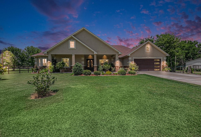 1827 E Cedar Bayou Lynchburg Rd, Baytown, TX 77521 - view of front of property featuring stucco siding, driveway, a garage, and covered porch