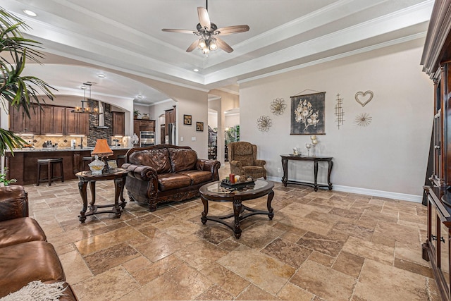 1827 E Cedar Bayou Lynchburg Rd, Baytown, TX 77521 - living room with stone tile flooring, ceiling fan, arched walkways, a raised ceiling, and crown molding