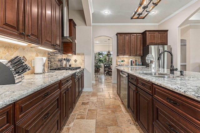 1827 E Cedar Bayou Lynchburg Rd, Baytown, TX 77521 - kitchen with arched walkways, a sink, appliances with stainless steel finishes, stone tile floors, and a chandelier