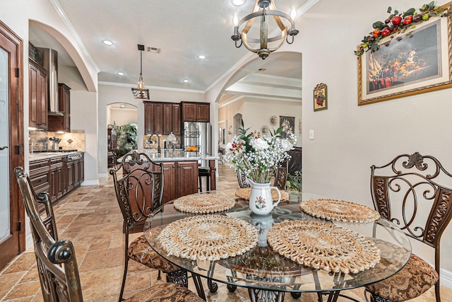 1827 E Cedar Bayou Lynchburg Rd, Baytown, TX 77521 - dining space featuring arched walkways, stone tile floors, ornamental molding, a chandelier, and recessed lighting