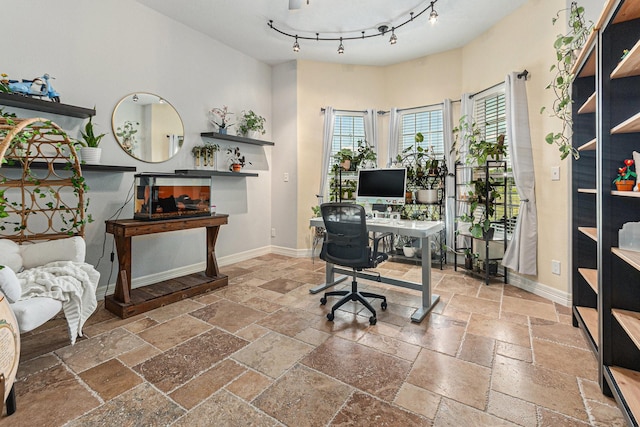 1827 E Cedar Bayou Lynchburg Rd, Baytown, TX 77521 - office space featuring stone tile flooring, baseboards, and rail lighting