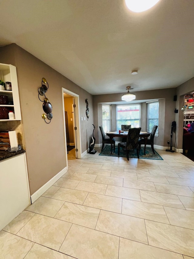 6639 Seaton Valley Dr, Spring, TX 77379 - dining space featuring light tile patterned flooring and baseboards