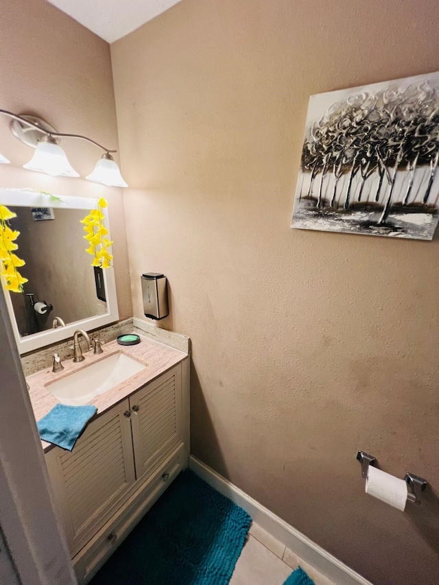 6639 Seaton Valley Dr, Spring, TX 77379 - bathroom with vanity, tile patterned floors, and baseboards