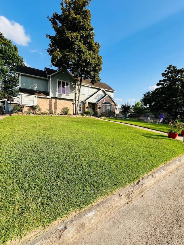 6639 Seaton Valley Dr, Spring, TX 77379 - view of front of house with a front lawn and brick siding