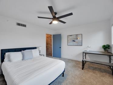 3809 N Braeswood Unit 14, Houston, TX 77025 - carpeted bedroom featuring ceiling fan