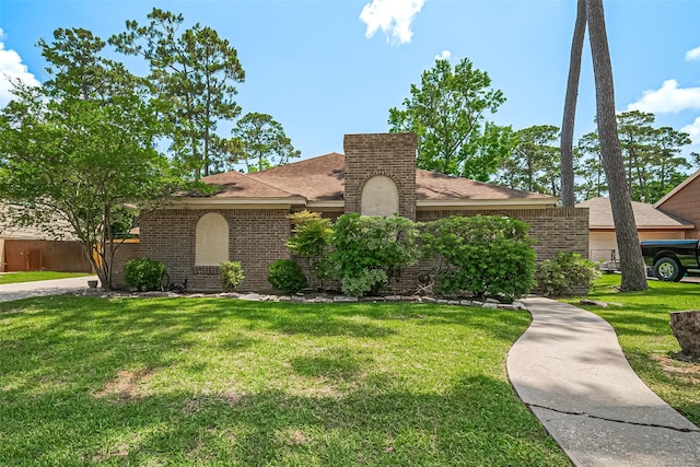 3705 Autumn Ln, Baytown, TX 77521 - view of front of house featuring brick siding, roof with shingles, and a chimney