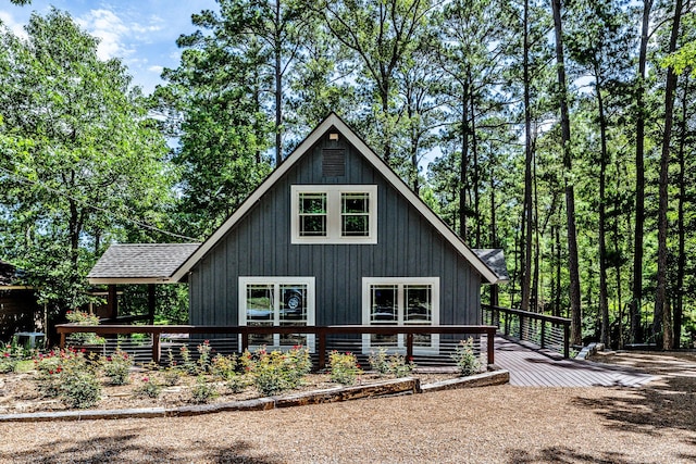 44 Post Oak Dr, Huntsville, TX 77320 - view of side of property featuring a wooden deck and roof with shingles