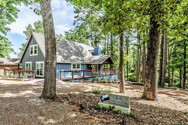 44 Post Oak Dr, Huntsville, TX 77320 - back of house with a deck and roof with shingles