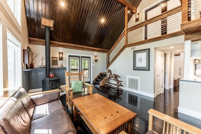 44 Post Oak Dr, Huntsville, TX 77320 - living room with a wood stove, high vaulted ceiling, wood ceiling, baseboards, and wood finished floors