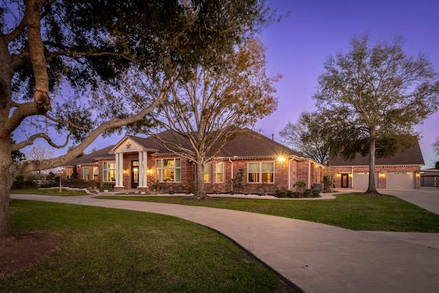 1802 Snow Goose Ln, Katy, TX 77493 - view of front facade with curved driveway, a front lawn, and brick siding