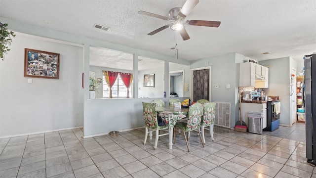 3814 Ripplebrook Dr, Houston, TX 77045 - dining room with a textured ceiling, ceiling fan, light tile patterned flooring, and baseboards