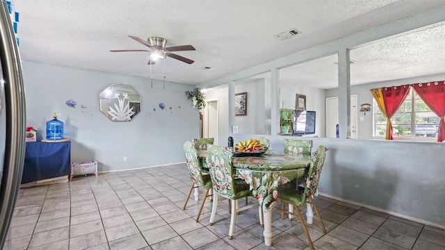 3814 Ripplebrook Dr, Houston, TX 77045 - dining room featuring a ceiling fan, tile patterned floors, and a textured ceiling